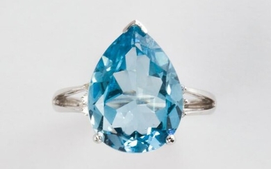 A blue topaz, diamond and fourteen karat white gold