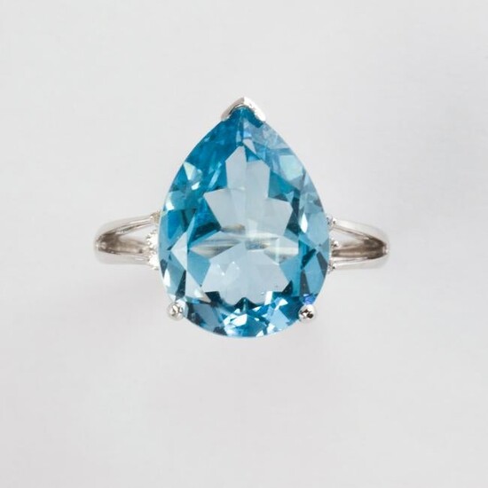 A blue topaz, diamond and fourteen karat white gold