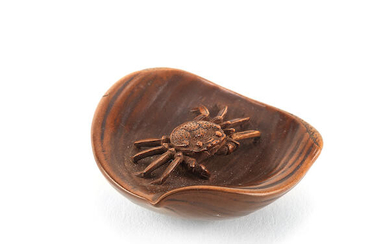 A boxwood netsuke of a crab in a chestnut