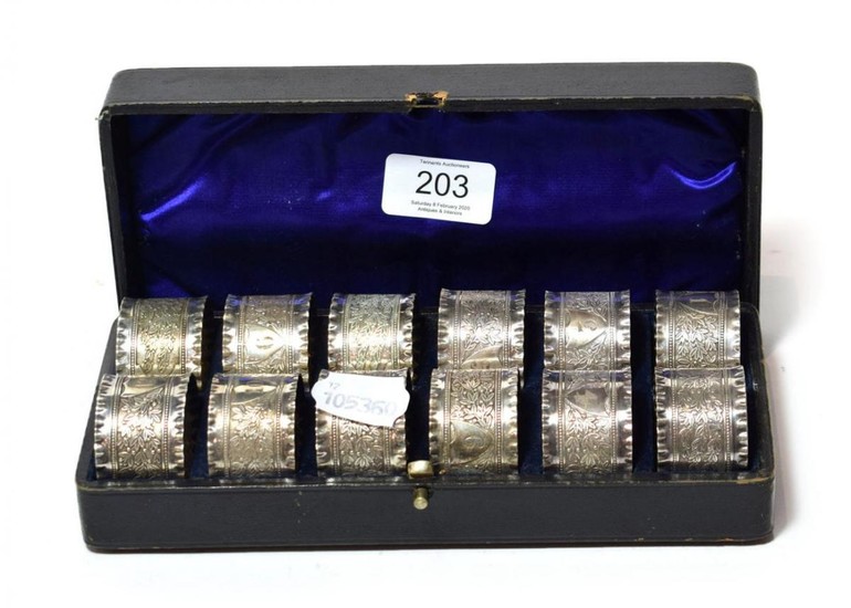 A cased set of twelve Victorian silver plated napkin rings,...