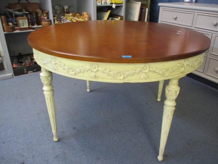 A circular hardwood dining table of French style, turned, ta...