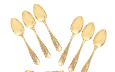 A collection of American 18k gold teapspoons and sugar tongs