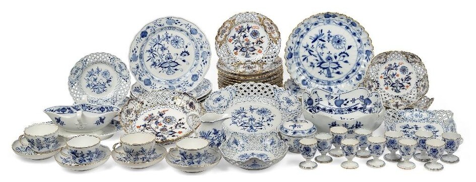 A collection of Meissen porcelain Zweibelmuster 'Blue Onion' pattern dinner wares, early 20th century, blue underglaze crossed swords marks, some with cancellation strikes, comprising: a deep dish, 9cm high, 22cm diameter, a reticulated bowl with...