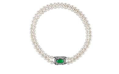 A cultured pearl necklace and bracelet suite with jade and diamond clasps, circa 1950