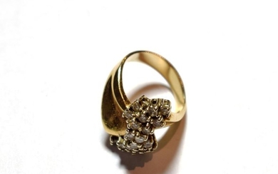 A diamond cluster ring, asymmetric form, set with twenty round...