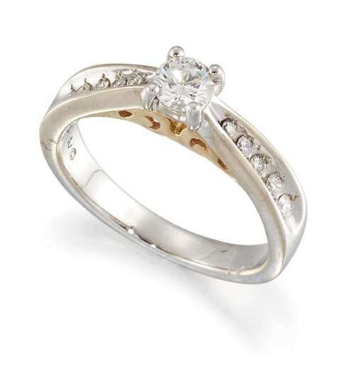 A diamond single stone ring, the brilliant-cut diamond in claw...