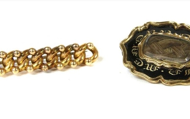 A gold curb link bar brooch