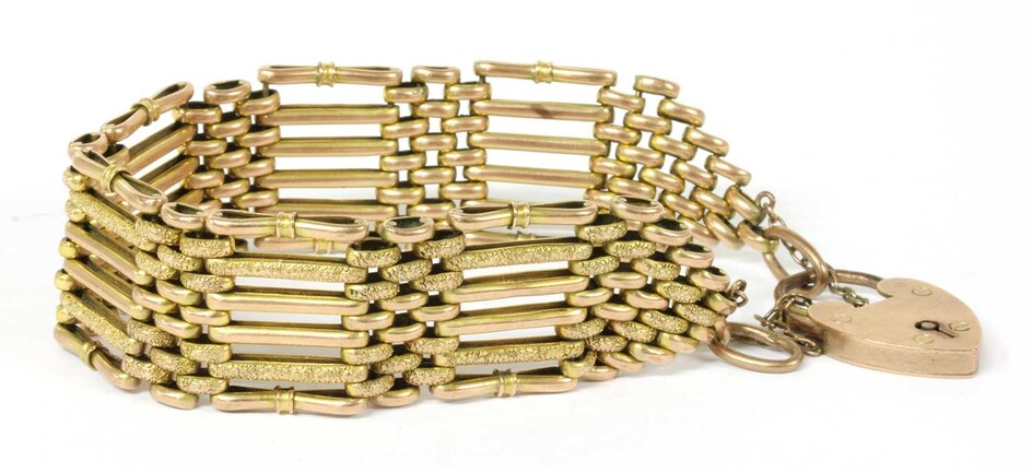 A gold six row gate bracelet