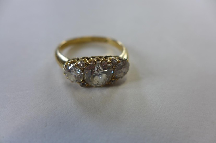 A good 18ct seven stone diamond ring, the centre stone appro...