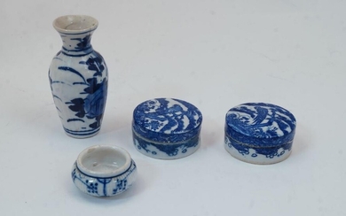 A group of miniature Chinese blue and white porcelain, 20th century, to include a baluster vase decorated with flowers, 9.5cm high, a globular panelled bowl decorated with branching flowers, 3.8cm diameter, and two trinket boxes, each decorated to...