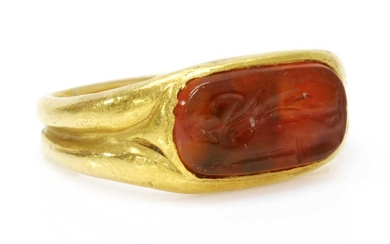 A high carat gold carved cornelian intaglio ring