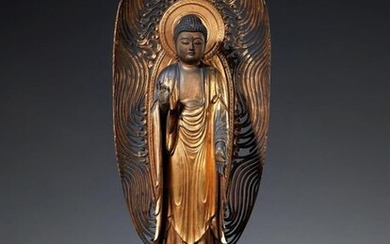 A lacquered and gilded wood figure of Amida Nyorai. Edo...