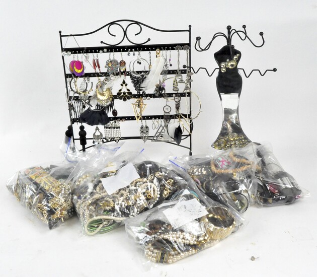 A large quantity of costume jewellery, including pairs of earrings, chains, necklaces, pendants