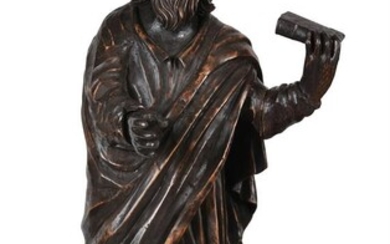 A large stained softwood model of a standing Saint