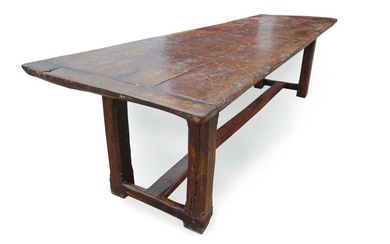 A late 17th century oak refectory table, the three plank...