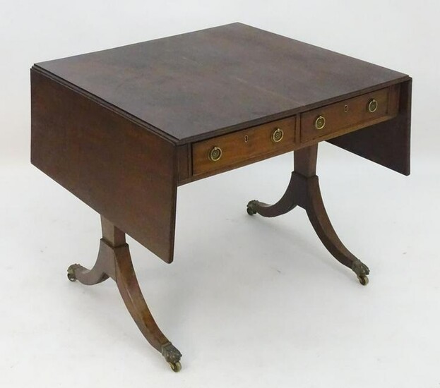 A late 18thC / early 19thC mahogany sofa table with a