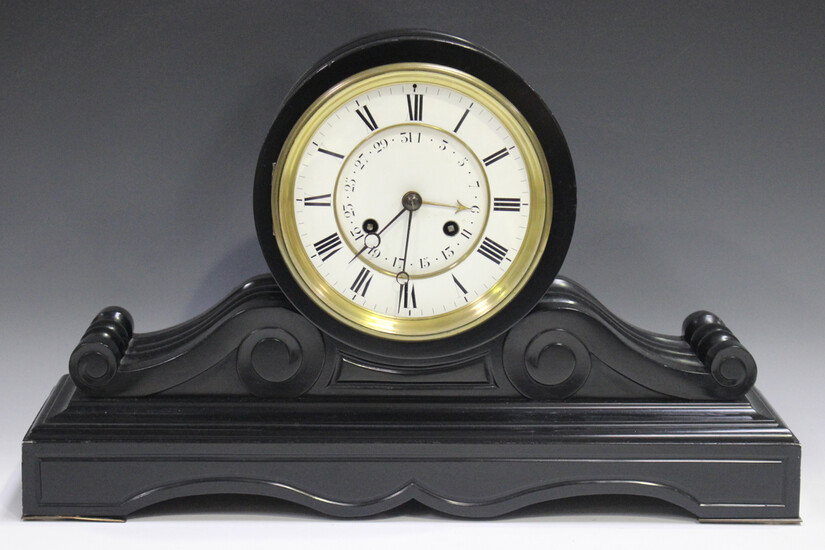 A late 19th century French slate calendar mantel clock, the two train movement of long duration, pro