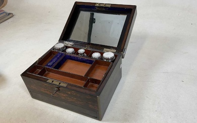 A mid 19th century coromandel lady’s vanity box with glass...