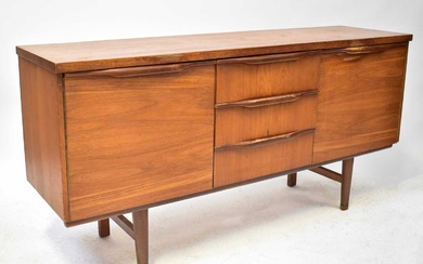 A mid-20th century teak sideboard with three short drawers and...
