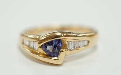 A modern 14ct and single stone tanzanite and graduated eight...