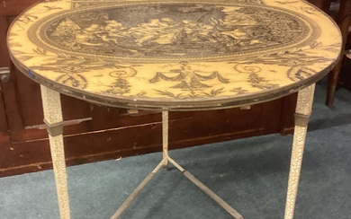 A modern circular table with decoration. Est. £30