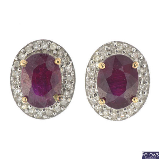 A pair of 9ct gold glass-filled ruby and diamond cluster earrings.
