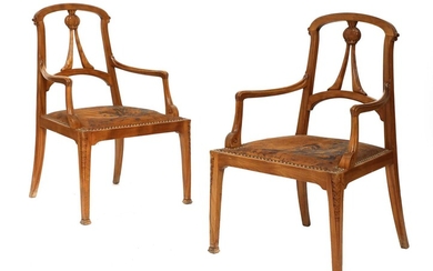 A pair of Art Nouveau walnut armchairs
