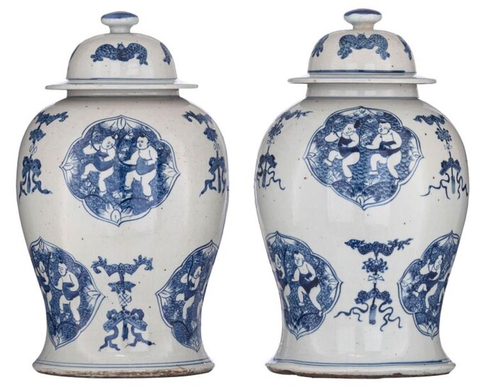 A pair of Chinese blue and white covered vases, the...