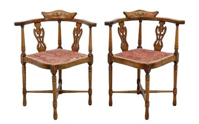 A pair of Edwardian mahogany and inlaid corner chairs.