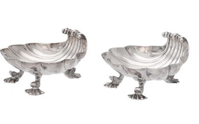 A pair of George II silver shell shaped butter dishes by Christian Hillan