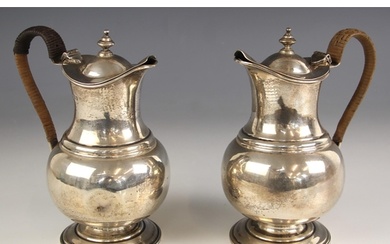 A pair of George V silver coffee pots, Pairpoint Brothers, L...