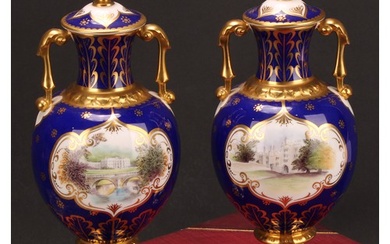 A pair of Royal Crown Derby pedestal ovoid two handled vases...