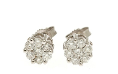 A pair of diamond ear studs each set with seven brilliant-cut diamonds totalling app. 0.90 ct., mounted in 18k white gold. Diam. 7 mm. (2)