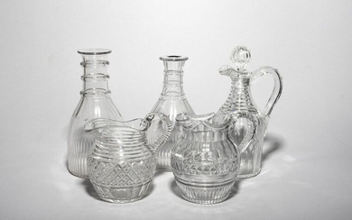 A pair of glass carafes early 19th century, cut with...