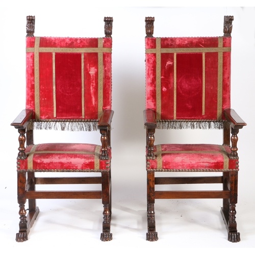 A pair of large late 16th century walnut and upholstered arm...