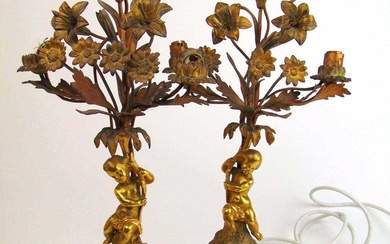 A pair of late 19th century gilt metal candelabrum, the...
