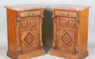 A pair of late Victorian Aesthetic Movement oak cabinets, in the manner of Charles Bevan, the rouge
