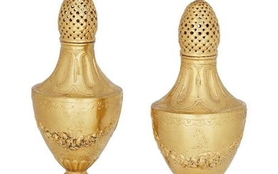 A pair of silver-gilt muffineers, London, 1904, imported by Faudel Phillips & Sons, 16cm high (2)