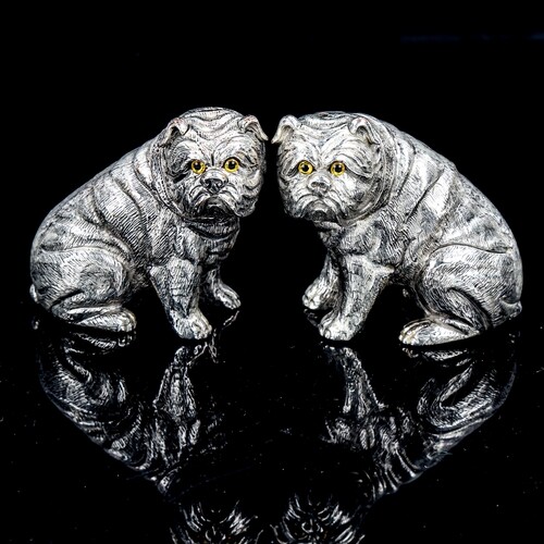 A pair of silver plated Bulldog design novelty cruets with g...