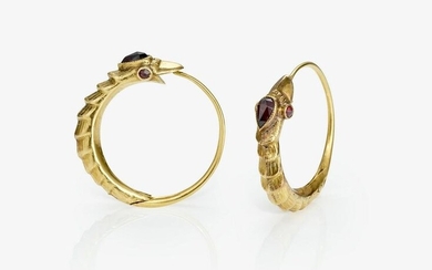 A pair of snake-shaped earrings with garnets