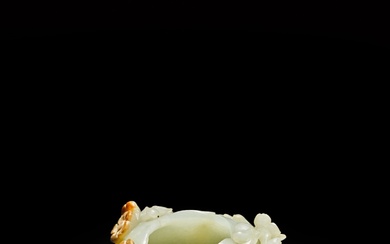 A pale celadon and russet jade 'peony' washer, 17th - 18th century | 十七至十八世紀 青白玉雕牡丹紋洗