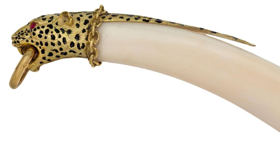 A pendant mount modelled as a leopard head, the mount with engraved and black enamel decoration and ruby-set eyes