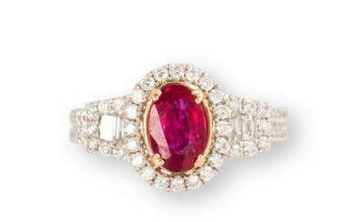 A ruby, diamond and fourteen karat white gold ring