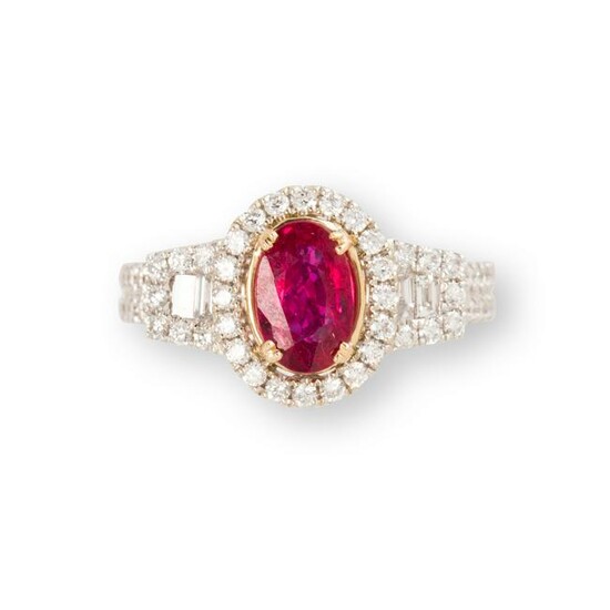 A ruby, diamond and fourteen karat white gold ring
