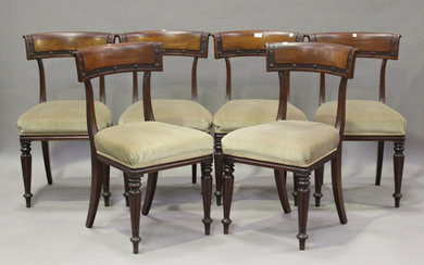 A set of six William IV mahogany bar back dining chairs with carved rosette decoration, the overstuf
