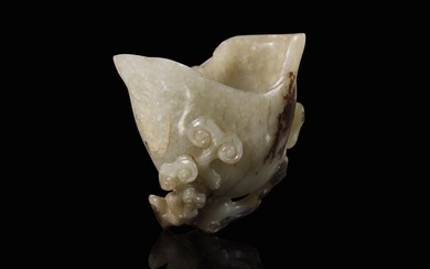 A small Chinese carved greyish-celadon and brown jade coupe, Qing dynasty or earlier 青&#28784
