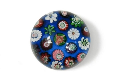 A small Clichy spaced millefiori glass paperweight