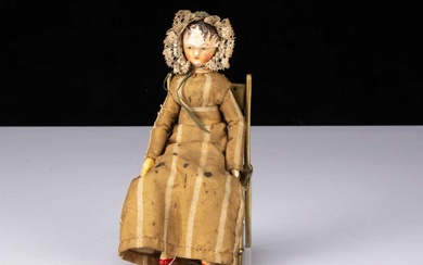 A small early 19th century Grodnerthal carved wooden doll