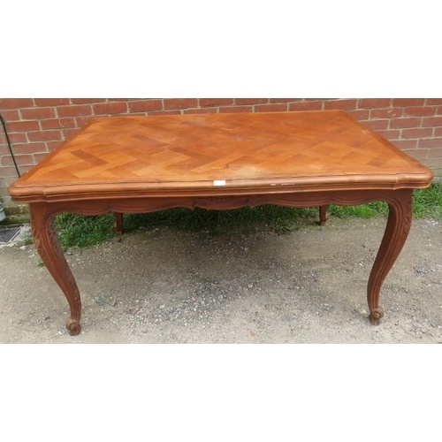 A vintage French walnut draw-leaf extending dining table, th...
