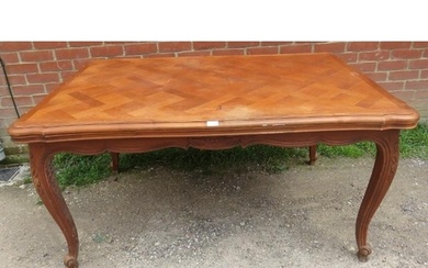 A vintage French walnut draw-leaf extending dining table, th...